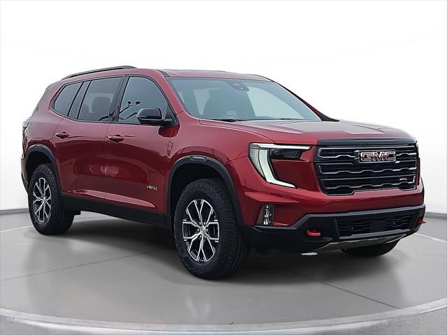 2026 GMC Acadia AT4 in Volcanic Red Tintcoat — front three-quarter view