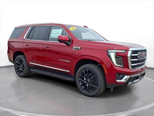 2026 GMC Yukon Elevation in Volcanic Red Tintcoat — front three-quarter view