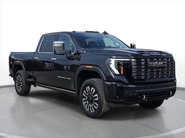 2026 GMC Sierra 2500 HD Denali Ultimate in Titanium Rush Metallic — front three-quarter view