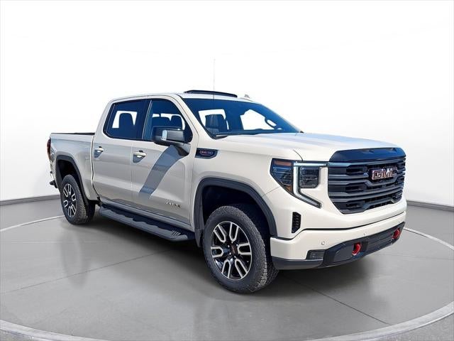 2026 GMC Sierra 1500 AT4 in Coastal Dune — front three-quarter view