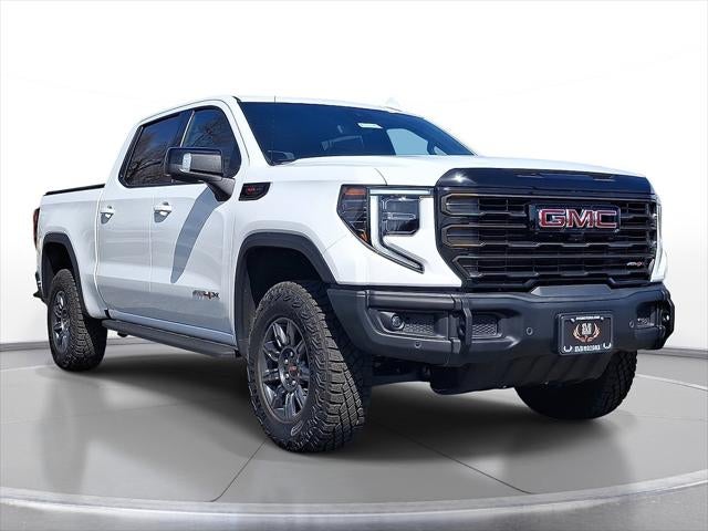 2024 GMC Sierra 1500 AT4X in Summit White — front three-quarter view