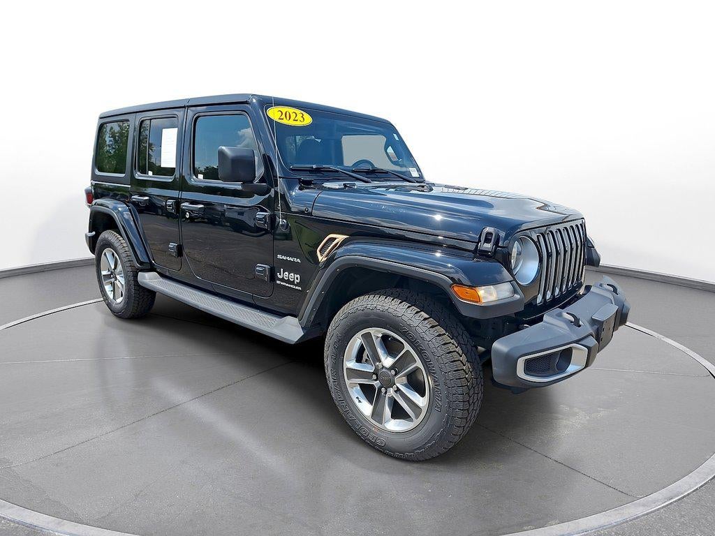 2023 Jeep Wrangler 4-Door Sahara 4x4 in Black Clearcoat — front three-quarter view