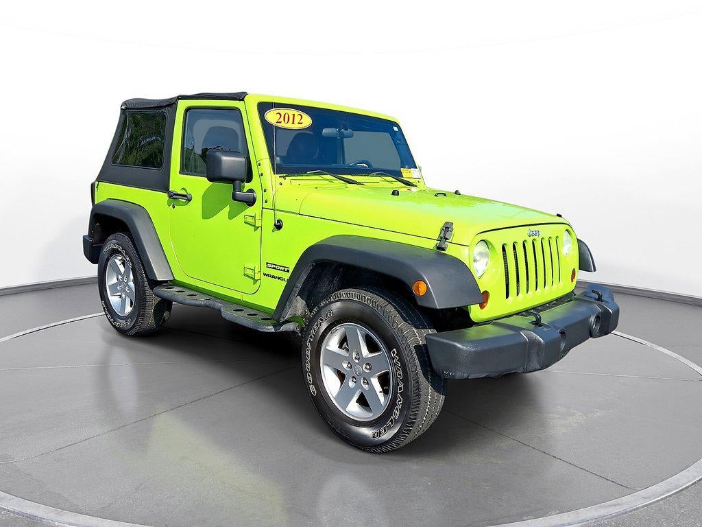 2012 Jeep Wrangler 4WD 2dr Sport in Gecko Pearl — front three-quarter view