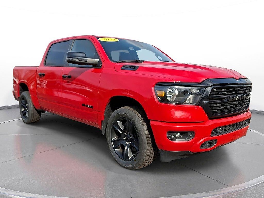 2023 RAM 1500 'Big Horn 4x4 Crew Cab 57'' Box' in Flame Red Clearcoat — front three-quarter view
