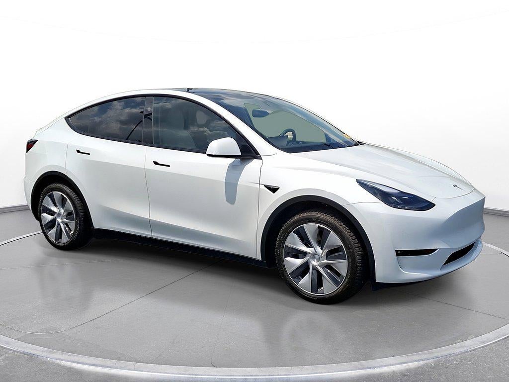 2023 Tesla Model Y Long Range AWD in Pearl White Multi-Coat — front three-quarter view