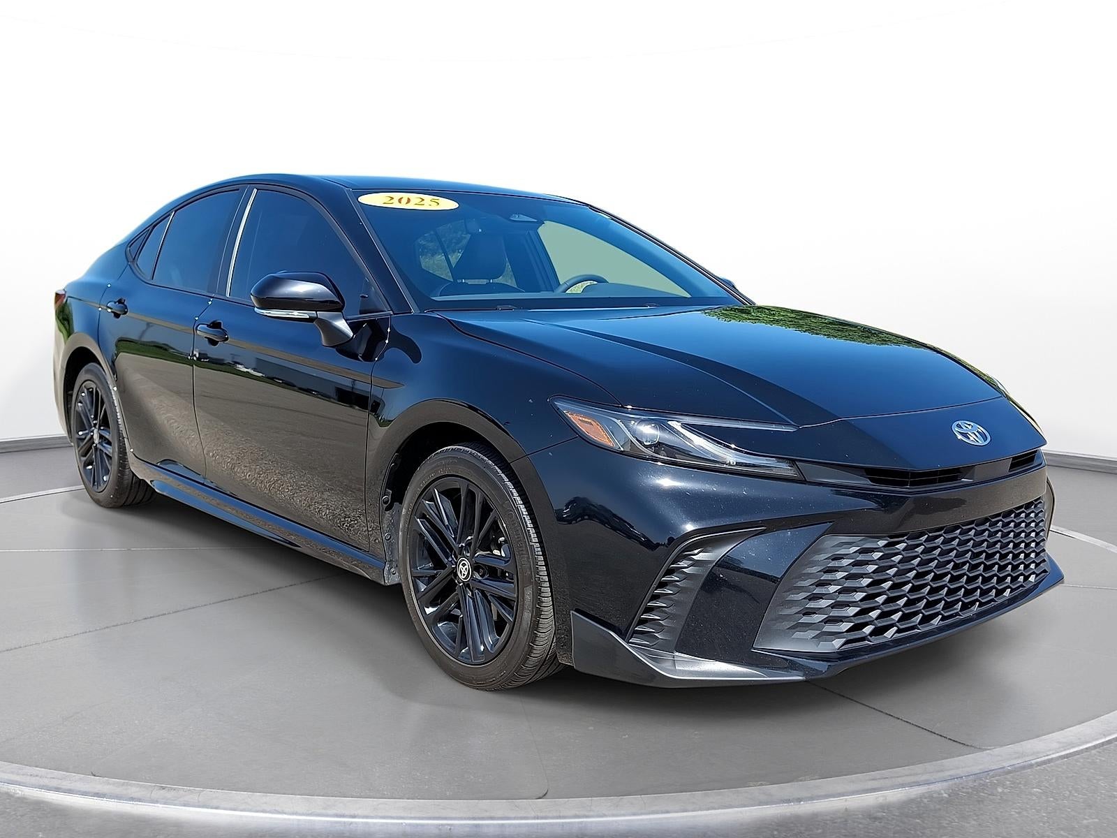 2025 Toyota Camry SE in Midnight Black Metallic — front three-quarter view