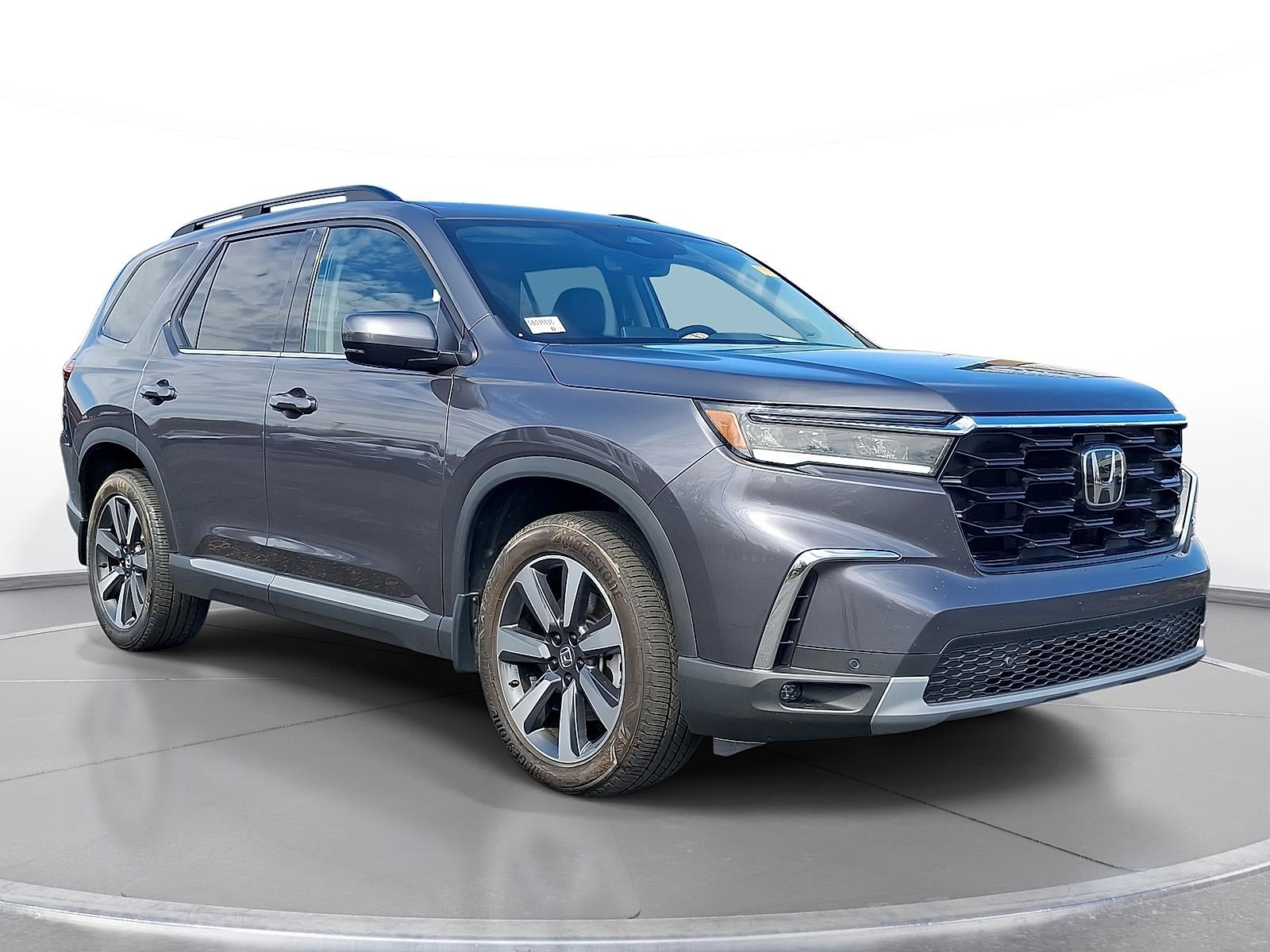 2025 Honda Pilot Touring in Modern Steel Metallic — front three-quarter view