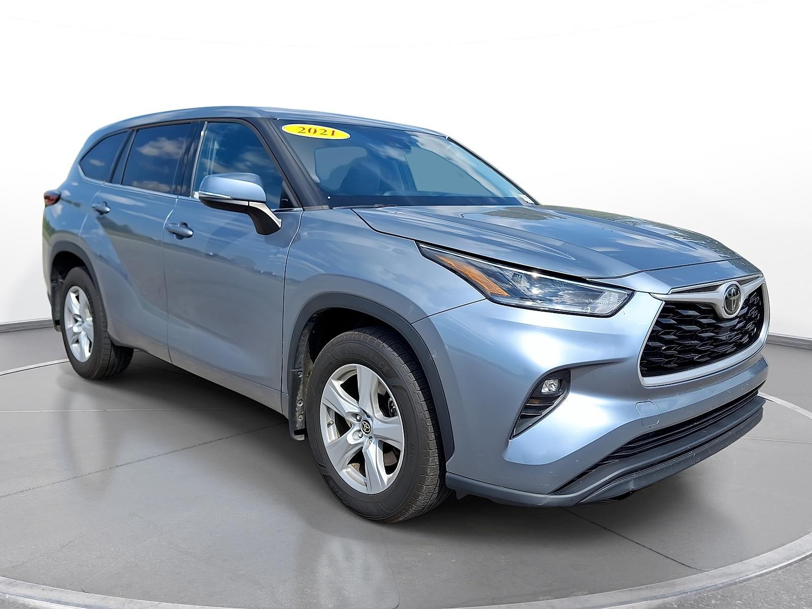 2021 Toyota Highlander LE in Moon Dust — front three-quarter view